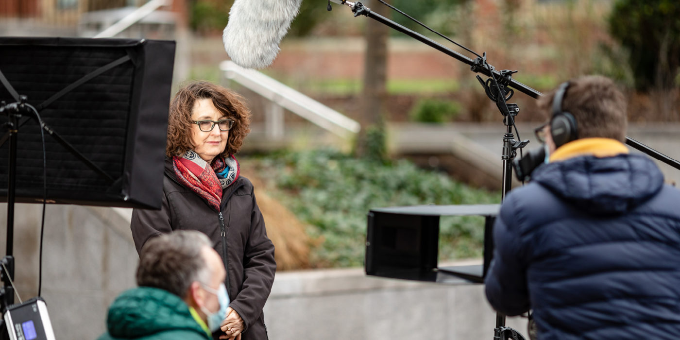 Vice Chancellor and President Professor Simone Buitendijk being filmed by a film crew on campus
